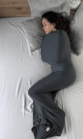 Person lying down and wrapped comfortably