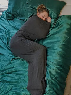 Person sleeping on green bedding