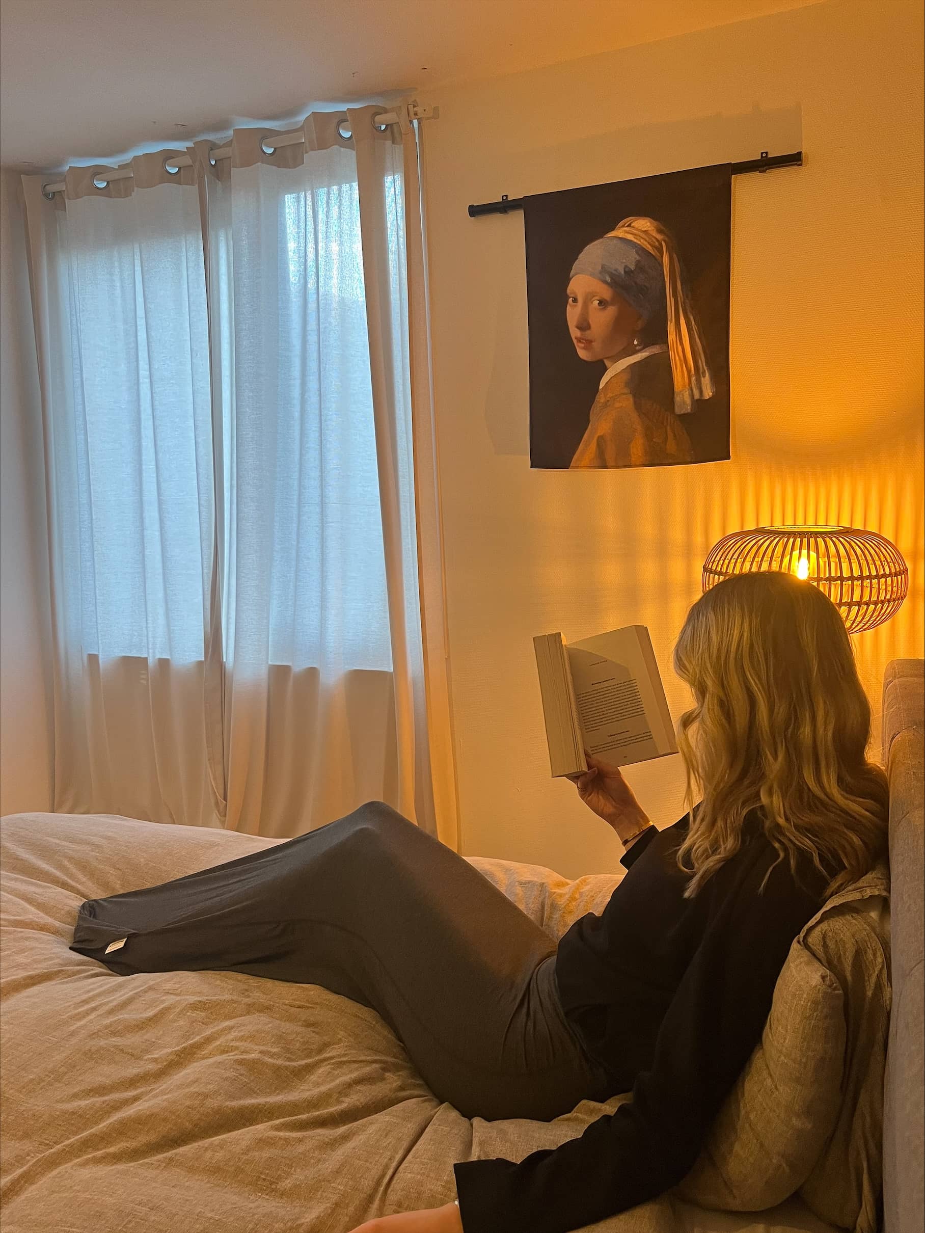 Person reading on a bed